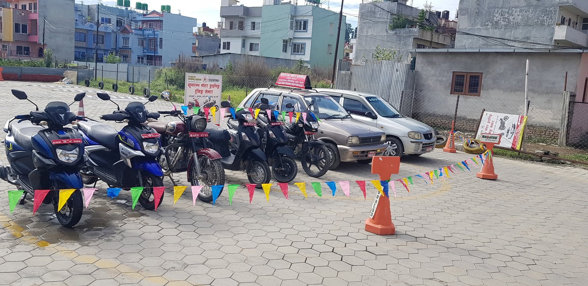Subharambha students and instructor with training vehicles